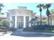 Stunning clubhouse exterior featuring classic architecture, landscaped grounds, and welcoming entrance at 2612 Robert Trent Jones Dr # 710, Orlando, FL 32835