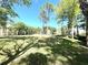 Beautiful view of the grounds with mature trees casting shadows on the lawn at 2612 Robert Trent Jones Dr # 710, Orlando, FL 32835