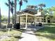 Well-maintained picnic area featuring shaded seating and grills for outdoor dining at 2612 Robert Trent Jones Dr # 710, Orlando, FL 32835