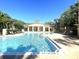 Sparkling swimming pool with sun loungers and well-maintained landscaping surrounding the area at 2612 Robert Trent Jones Dr # 710, Orlando, FL 32835