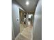 Hallway features sliding closet doors, with a stackable washer and dryer for convenient laundry access at 2624 Robert Trent Jones Dr # 610, Orlando, FL 32835