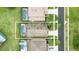 Aerial view of a property with a screened-in pool, showcasing the lot boundaries and neighborhood at 2787 Lido Key Dr, Kissimmee, FL 34747