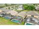 Aerial view of homes with screened pools in a vibrant residential community at 2787 Lido Key Dr, Kissimmee, FL 34747