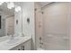 Bright bathroom featuring a shower/tub combo, white cabinets and countertops, and a mirror at 2787 Lido Key Dr, Kissimmee, FL 34747