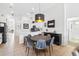 Dining area with a modern pendant light fixture, connected to the kitchen and living area at 2787 Lido Key Dr, Kissimmee, FL 34747