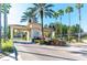 Community entrance gate with mature landscaping and paver road at 2787 Lido Key Dr, Kissimmee, FL 34747