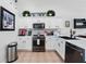 Well-lit kitchen with white cabinetry, stainless steel appliances, and tiled backsplash at 2787 Lido Key Dr, Kissimmee, FL 34747