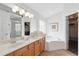 Bright main bathroom featuring double sinks, a soaking tub, and a walk-in shower at 2787 Lido Key Dr, Kissimmee, FL 34747