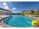 Community pool with small slide and zero entry area in a resort-style community at 430 Brunswick Dr, Davenport, FL 33837