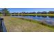 Backyard view overlooking a tranquil pond, showcasing the property's serene setting within the community at 430 Brunswick Dr, Davenport, FL 33837