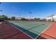 Community tennis courts with lighting and nearby playground equipment for residents at 430 Brunswick Dr, Davenport, FL 33837