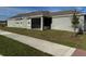 Exterior of the home featuring a screened in porch and a view of the backyard at 5111 Lake Hamlin Trl, Winter Garden, FL 34787