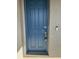 Classic blue front door with four panels, smart lock, and doorbell camera for added security and convenience at 5111 Lake Hamlin Trl, Winter Garden, FL 34787