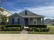 Charming single-story home featuring manicured landscaping and a welcoming entrance at 5111 Lake Hamlin Trl, Winter Garden, FL 34787