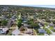 This aerial view displays a mature neighborhood with tree-lined streets and well-maintained homes at 516 Donaldson Dr, Debary, FL 32713