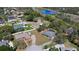 Expansive aerial view showcases the property with a lake, highway, and surrounding neighborhood at 516 Donaldson Dr, Debary, FL 32713