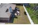 Aerial view of the home with outdoor patio and a well maintained private yard with fence at 516 Donaldson Dr, Debary, FL 32713