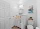 Bright bathroom with a vanity, medicine cabinet, toilet, and neutral color scheme with some decor touches at 516 Donaldson Dr, Debary, FL 32713