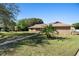 Charming single-story brick home with a well-manicured lawn and beautiful landscaping at 516 Donaldson Dr, Debary, FL 32713