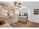 Well-lit kitchen features granite countertops, wooden cabinets, and stainless steel appliances for a modern feel at 516 Donaldson Dr, Debary, FL 32713