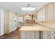 Bright kitchen featuring light wood cabinets, granite countertops, and a skylight for ample natural light at 516 Donaldson Dr, Debary, FL 32713