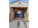 Organized shed interior with tools, ladders, storage bins, and a window for natural light at 516 Donaldson Dr, Debary, FL 32713