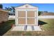 A well-maintained shed with double doors and a ramp, offering convenient storage solutions at 516 Donaldson Dr, Debary, FL 32713