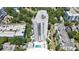 Stunning aerial view showcasing the high-rise condo, pool, and surrounding cityscape and trees at 530 E Central Blvd # 1901, Orlando, FL 32801