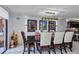 Elegant dining area featuring modern chandelier, artistic wall decor, and city views at 530 E Central Blvd # 1901, Orlando, FL 32801