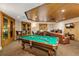 Inviting game room with a pool table, seating, and entertainment center at 530 E Central Blvd # 1901, Orlando, FL 32801