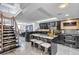 Modern kitchen with steel staircase, marble tile flooring, and dining area at 530 E Central Blvd # 1901, Orlando, FL 32801