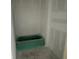 Bathroom with a green tub, concrete floors, and white walls at 5738 Cattle Ranch Dr, St Cloud, FL 34771