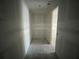 Hallway with smooth concrete floors and access to other rooms at 5738 Cattle Ranch Dr, St Cloud, FL 34771