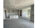 View of a spacious kitchen featuring unfinished drywall and bare concrete floors, offering a blank canvas at 5738 Cattle Ranch Dr, St Cloud, FL 34771