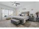 Elegant bedroom with a stylish bed frame, ample natural light, and contemporary decor at 588 Hitch Loop, St Cloud, FL 34772