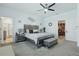 Bright bedroom featuring stylish furniture, contemporary accents, and a view of the ensuite bathroom at 588 Hitch Loop, St Cloud, FL 34772