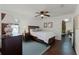 Bedroom features hardwood floors, a ceiling fan, and a window at 651 Robinhood Dr, Maitland, FL 32751