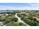 A neighborhood with an areal view, and a glimpse of Volcano Bay in the distance at 6847 Sperone St, Orlando, FL 32819