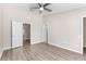 Bedroom with wood-look floors and multiple doorways at 6847 Sperone St, Orlando, FL 32819