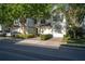Beautiful exterior of a two-story townhome featuring a one-car garage and brick driveway at 6847 Sperone St, Orlando, FL 32819