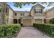 Charming townhome featuring a two-car garage and well-manicured landscaping at 6847 Sperone St, Orlando, FL 32819