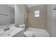 Neat bathroom with tiled walls, a shower-tub combination, and a modern vanity sink at 73 Garrison Ln, Frostproof, FL 33843