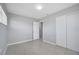 A spacious bedroom with tile floors, fresh paint, and a generously sized closet at 73 Garrison Ln, Frostproof, FL 33843