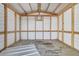 Inside of a storage shed with exposed framework and a concrete floor at 73 Garrison Ln, Frostproof, FL 33843