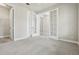 Spacious room with neutral tones, closet, french doors, and carpet at 8433 Corkfield Ave, Orlando, FL 32832