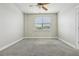 Bedroom featuring carpet flooring, a window and a ceiling fan at 8433 Corkfield Ave, Orlando, FL 32832