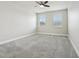 Bedroom with neutral colors and carpet with ceiling fan at 8433 Corkfield Ave, Orlando, FL 32832