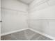 Walk-in closet with carpet flooring and white wire shelving at 8433 Corkfield Ave, Orlando, FL 32832