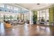 Beautiful clubhouse featuring high ceilings, hardwood floors, decorative chandeliers and abundant natural light at 8433 Corkfield Ave, Orlando, FL 32832