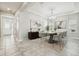 Bright dining room featuring modern decor, a stylish table, and beautiful artwork at 8433 Corkfield Ave, Orlando, FL 32832